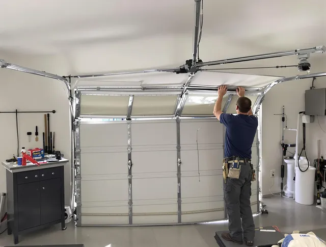 Wareham Garage Door Repair specialist performing precise section replacement on Wareham garage door